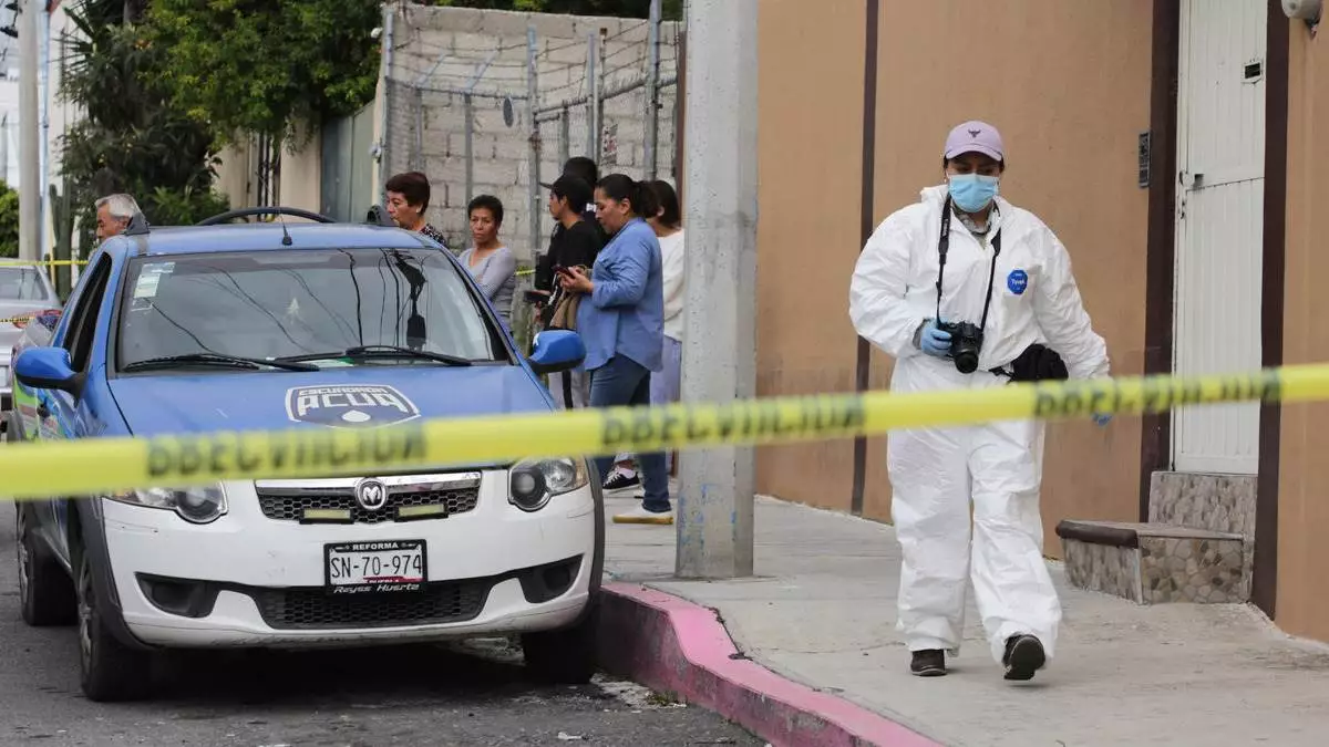 Un muerto y un herido deja riña a balazos entre vecinos en Puebla